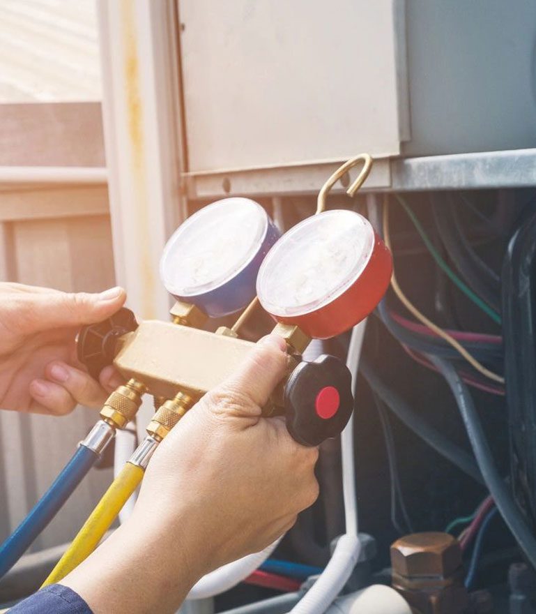 Technician is Checking Air Conditioner